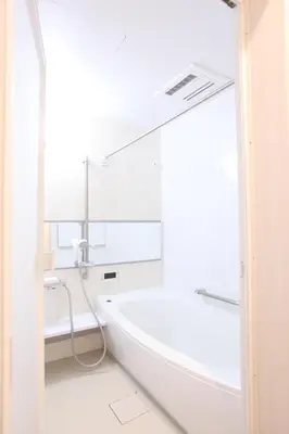 a white bathroom with a tub and a window at 3LDK, Functional and New house in convenient Shinjuku in Tokyo