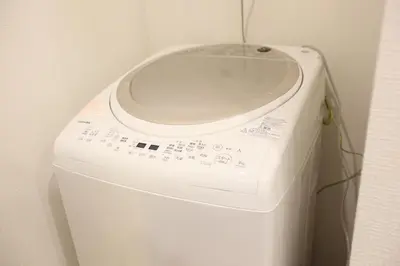 a white washer and dryer in a room at 3LDK, Functional and New house in convenient Shinjuku in Tokyo