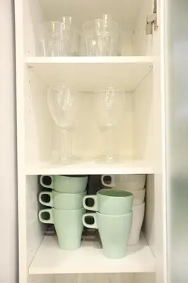 a cupboard filled with wine glasses and cups at 3LDK, Functional and New house in convenient Shinjuku in Tokyo