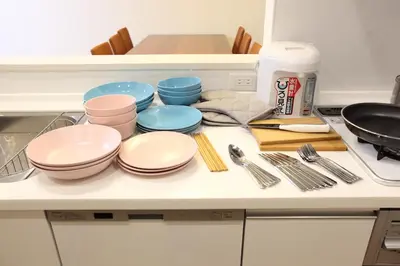 a kitchen counter with a bunch of plates and utensils at 3LDK, Functional and New house in convenient Shinjuku in Tokyo