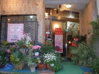 a flower shop with potted plants in front of it at \u30db\u30c6\u30eb\u3072\u304b\u308a in Tokyo