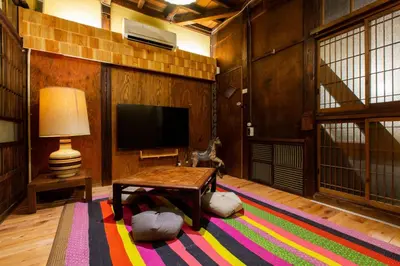 a living room with a table and a television at Shinagawa-ku - House / Vacation STAY 12126 in Tokyo