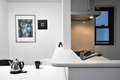 a kitchen with a sink and a counter top at LANG Hotel Ginza 1LDK in Tokyo
