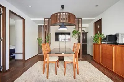 a dining room with a table and chairs at Kyodo Private House in Tokyo