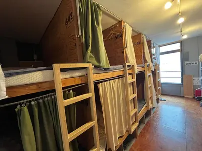 a group of bunk beds in a room at Hostel Bedgasm in Tokyo