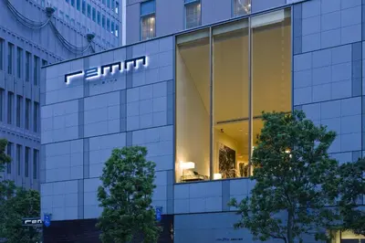 a building with a sign on the side of it at remm Hibiya in Tokyo