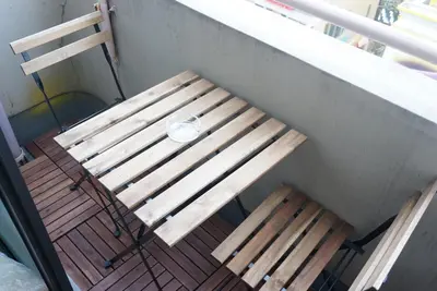 a wooden bench sitting on top of a porch at V.Close to Shinjuku Kabukicho/Korean Town/FrWIFI A in Tokyo