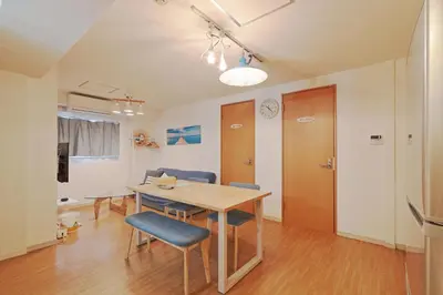 a dining room with a wooden table and chairs at V.Close to Shinjuku Kabukicho/Korean Town/FrWIFI A in Tokyo