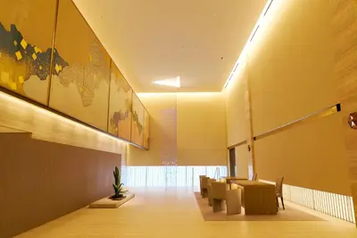a conference room with a table and chairs and a map on the wall at The Okura Tokyo in Tokyo