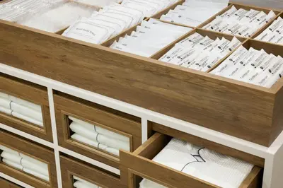 a drawer full of white linens in a cabinet at Four Points Flex by Sheraton Tokyo Shibuya West in Tokyo
