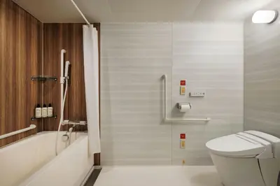 a bathroom with a toilet and a shower at Four Points Flex by Sheraton Tokyo Shibuya West in Tokyo