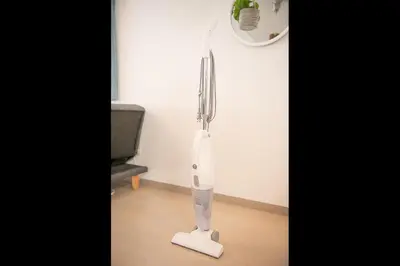 a white hair dryer sitting on the floor in a room at LY INN Ryogoku Annex in Tokyo