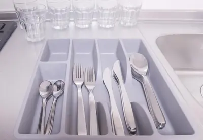 a tray with silver utensils in a sink at LY INN Ryogoku Annex in Tokyo