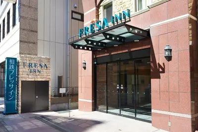 a facade of a building with a sign on it at Sotetsu Fresa Inn Nihombashi Kayabacho in Tokyo