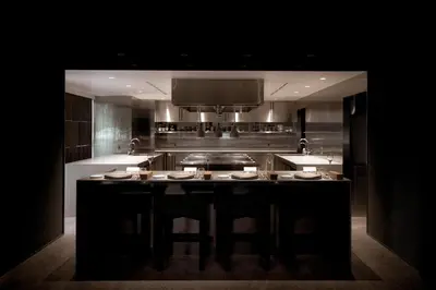 a kitchen with a island in the middle of a kitchen at DDD HOTEL in Tokyo