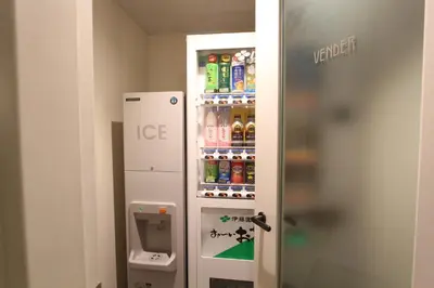 a room with a refrigerator with drinks in it at KOKO HOTEL Premier Nihonbashi Hamacho in Tokyo