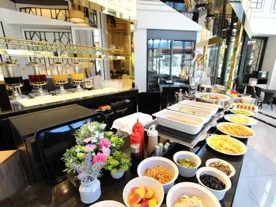 a buffet line with different types of food on it at KOKO HOTEL Premier Nihonbashi Hamacho in Tokyo