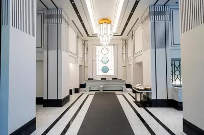 a hallway with a bench and a window at KOKO HOTEL Premier Nihonbashi Hamacho in Tokyo