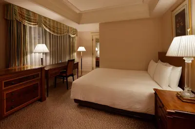 a hotel room with a bed and a desk at Rihga Royal Hotel Tokyo in Tokyo