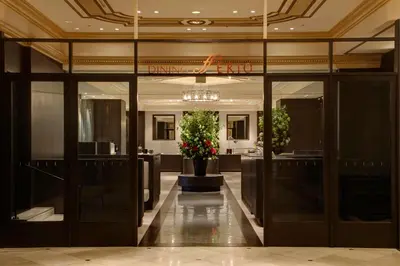 a lobby with glass doors and a plant in a pot at Rihga Royal Hotel Tokyo in Tokyo