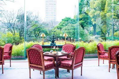 a group of chairs and a table with food on it at Rihga Royal Hotel Tokyo in Tokyo