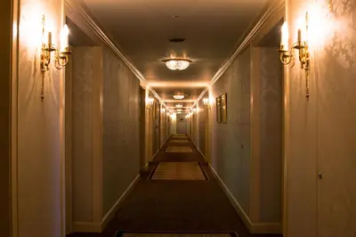 a long hallway with lights on the sides of a building at Rihga Royal Hotel Tokyo in Tokyo