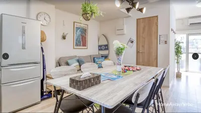 a kitchen and living room with a table and a refrigerator at V.Close to Shinjuku Kabukicho/Korean Town/FrWIFI C in Tokyo
