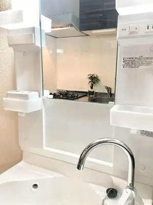 a white kitchen with a sink and a faucet at Alo BnB 3 - Near KOMAGOME, IKEBUKURO, SHINJUKU, UENO - MAX 16 PAX in Tokyo