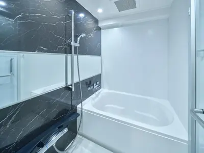 a bathroom with a shower and a bath tub at Sakura Cross Hotel Akihabara in Tokyo