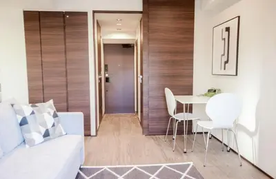 a living room with a white couch and a table at Dash Living Tsukiji in Tokyo