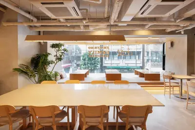 a conference room with a large table and chairs at the b sangenjaya in Tokyo