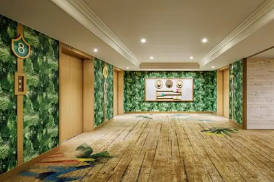 an empty room with green walls and wooden floors at Sheraton Grande Tokyo Bay Hotel in Urayasu