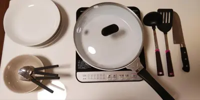 a table with a kitchen utensils and a food scale at Sun Hotel in Tokyo