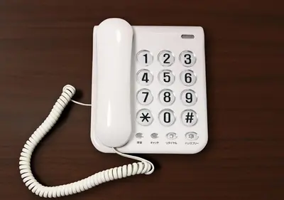 a white phone sitting on top of a table at Hotel Trend Tobu Asakusa-Eki Kita in Tokyo