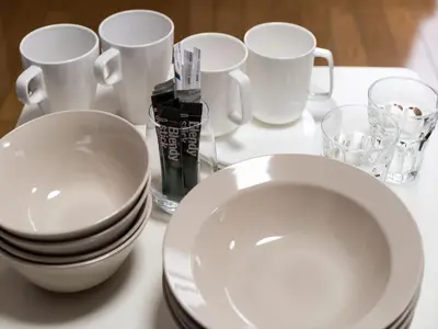 a white table with white plates and cups on it at Murata COPO 305 / Vacation STAY 2893 in Tokyo