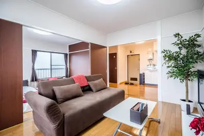 a living room with a couch and a table at Murata COPO 305 / Vacation STAY 2893 in Tokyo