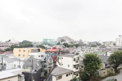 an aerial view of a city with buildings at Dwell Urban 7B in Tokyo