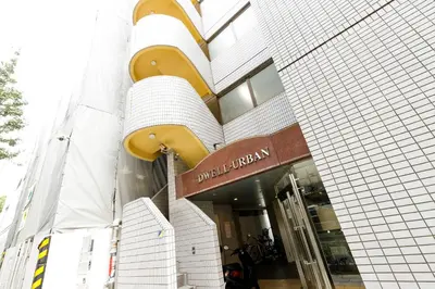 a building with a sign that reads united library at Dwell Urban 6D in Tokyo