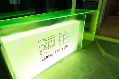 a glass display case with a sign on it at MANGA ART HOTEL, TOKYO in Tokyo