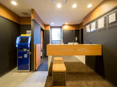 a store with a bench in the middle of a room at Super Hotel Tokyo Kameido in Tokyo