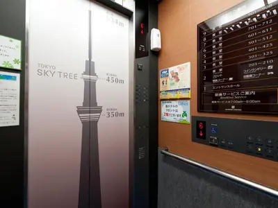 a wall with a graphic of the sky tower at Super Hotel Tokyo Kameido in Tokyo