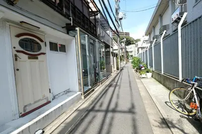 a bike parked on a sidewalk next to a building at COCO Nakameguro301 in Tokyo