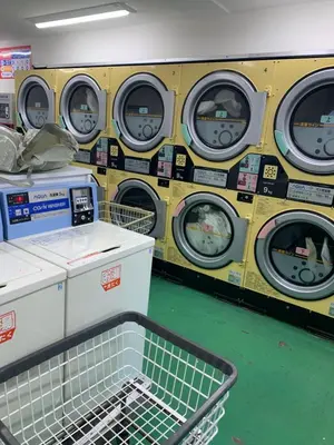 a row of washing machines in a laundrette at COCO Nakameguro302 in Tokyo