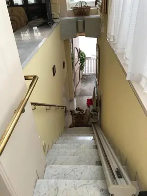 a stairway leading up to a room with yellow walls at near shibuya quiet residential area in Tokyo