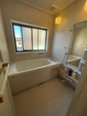 a bathroom with a bath tub and a window at near shibuya quiet residential area in Tokyo