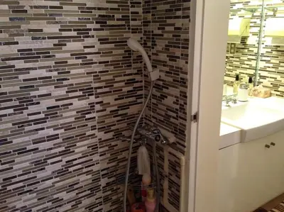 a bathroom with a shower and a sink at near shibuya quiet residential area in Tokyo
