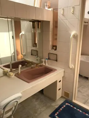 a bathroom with a large sink and a mirror at near shibuya quiet residential area in Tokyo
