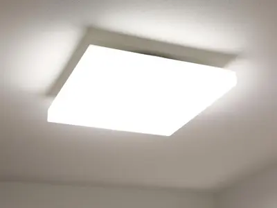 an opening in a white room with a light bulb at APA Hotel Komagome Ekimae in Tokyo