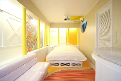 a hospital room with a bed and a window at HOTEL DCUBE in Tokyo