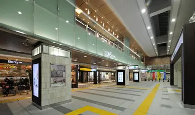an empty shopping mall with a large building at HOTEL DCUBE in Tokyo